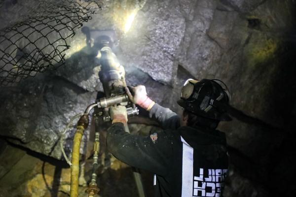 Man drilling in an underground mine